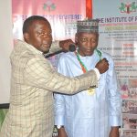 Professor Umar Kyari Sandabe -the Vice Chancellor being decorated by IRAMN Registrar